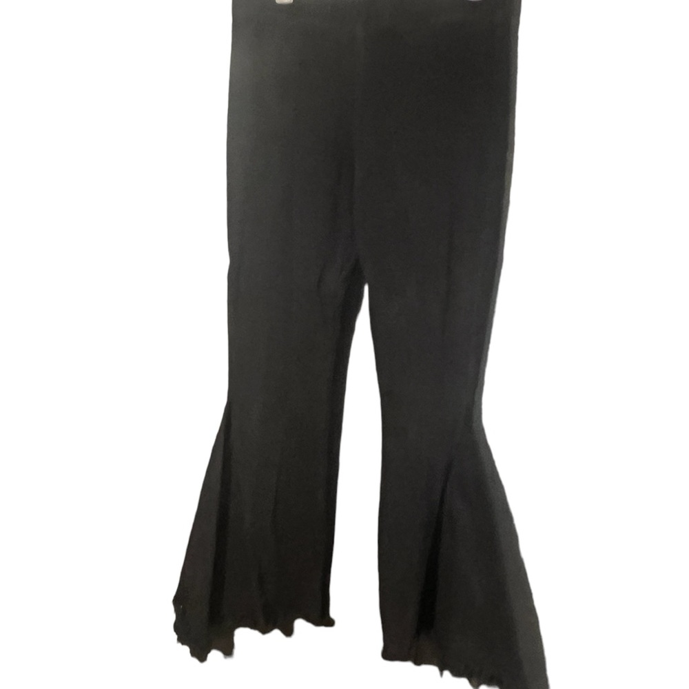 From classy cowgirl. Super flared black jeans with elastic waist. Size 2x